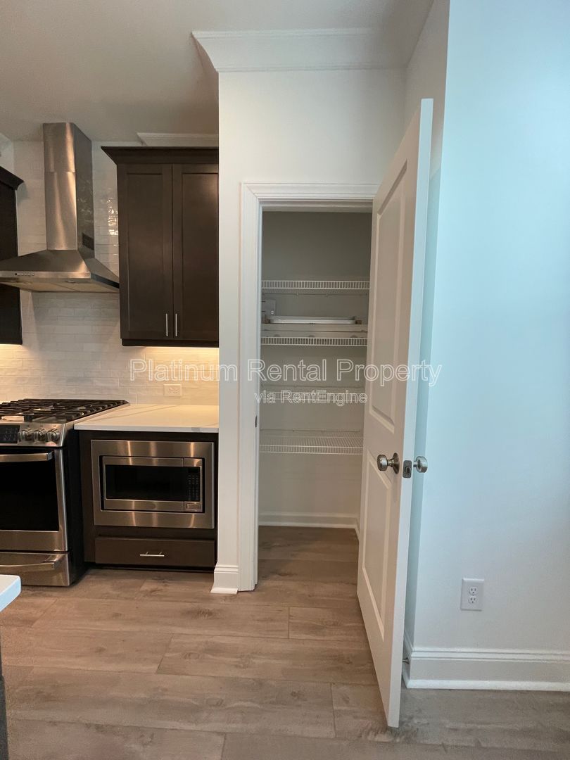 Meticulously maintained and better than new, 3 bedroom, 3.5 bathrooms in FANTASTIC gated Buford neighborhood, by Platinum Property Management Services, Inc. property image