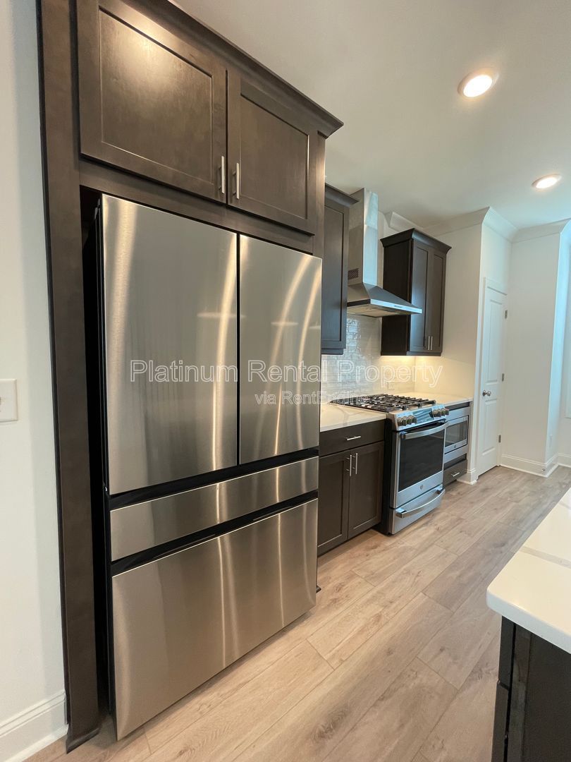 Meticulously maintained and better than new, 3 bedroom, 3.5 bathrooms in FANTASTIC gated Buford neighborhood, by Platinum Property Management Services, Inc. property image