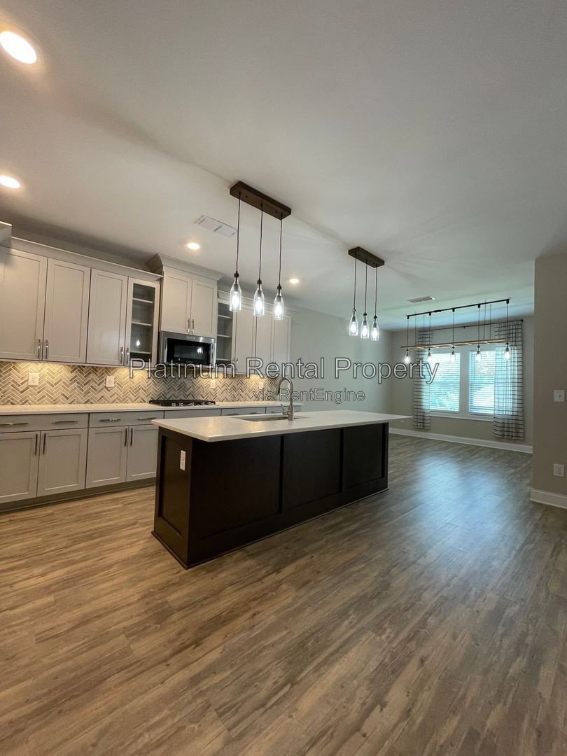 Exquisite 4 bedroom home on full basement in highly sought after Forsyth county neighborhood by Platinum Property Management Services, Inc. property image