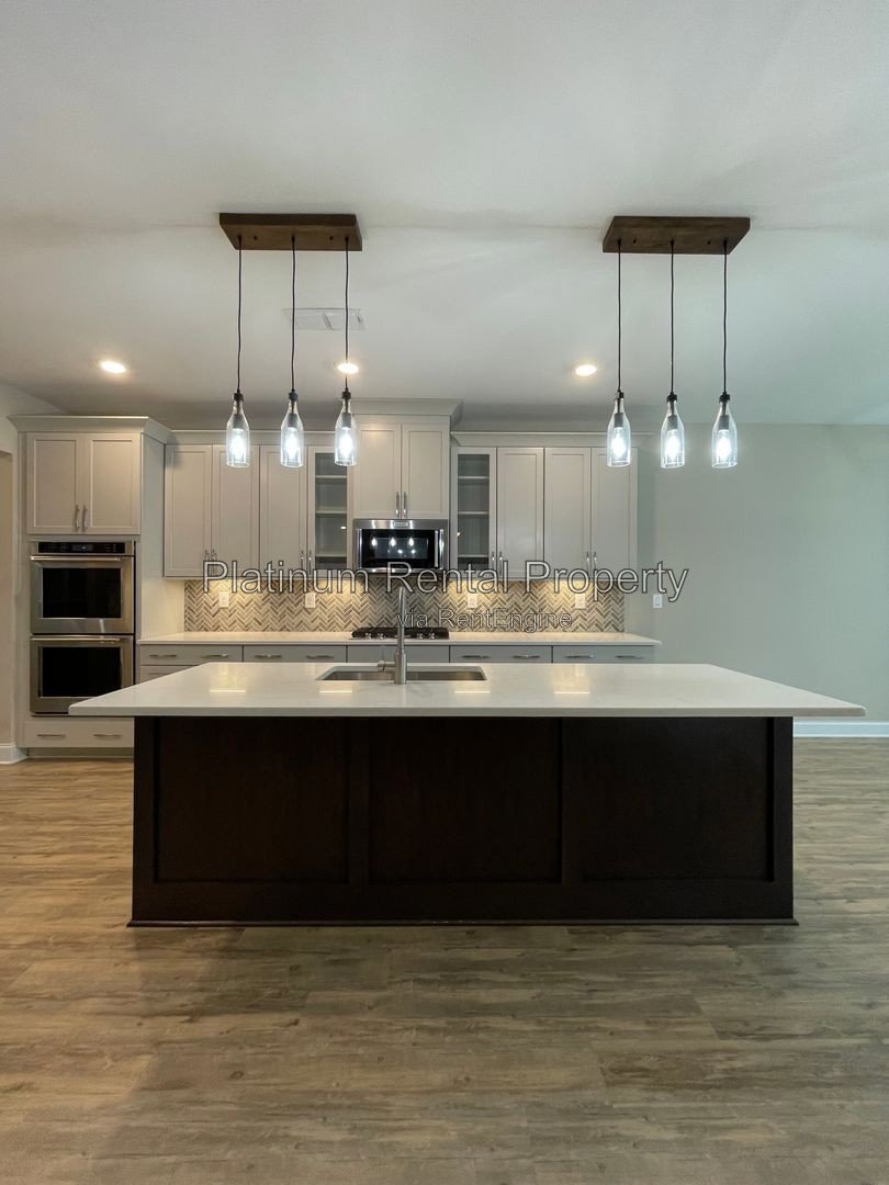 Exquisite 4 bedroom home on full basement in highly sought after Forsyth county neighborhood by Platinum Property Management Services, Inc. property image