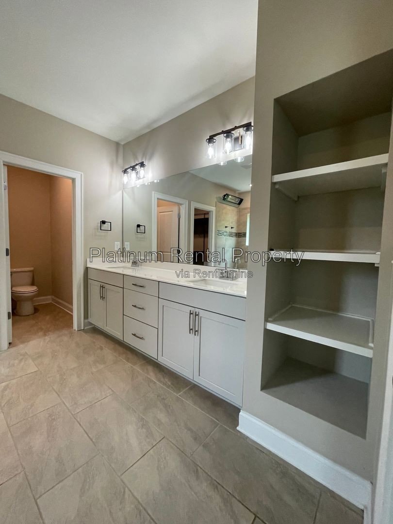 Exquisite 4 bedroom home on full basement in highly sought after Forsyth county neighborhood by Platinum Property Management Services, Inc. property image