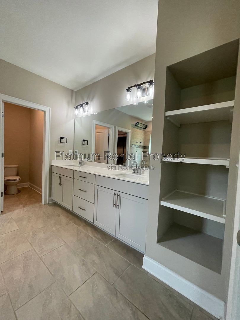 Exquisite 4 bedroom home on full basement in highly sought after Forsyth county neighborhood by Platinum Property Management Services, Inc. property image