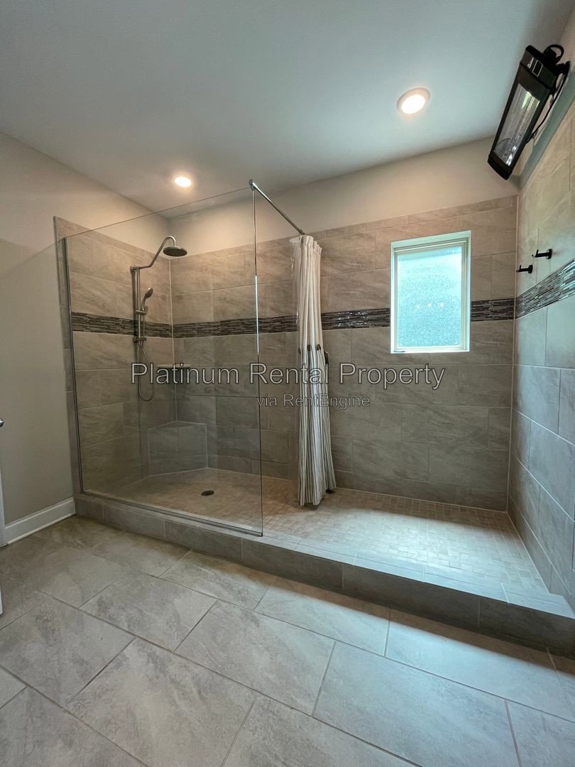Exquisite 4 bedroom home on full basement in highly sought after Forsyth county neighborhood by Platinum Property Management Services, Inc. property image