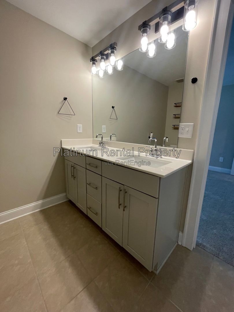 Exquisite 4 bedroom home on full basement in highly sought after Forsyth county neighborhood by Platinum Property Management Services, Inc. property image